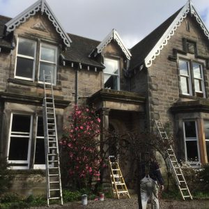 An old house being painted and decorated